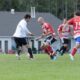 Players competing for the ball at Telkwa BBQ Grounds Park